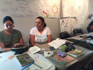 Margarita Cabrera instructs a participant in a workshop for the upcoming exhibit at the Desert Botanical Garden.