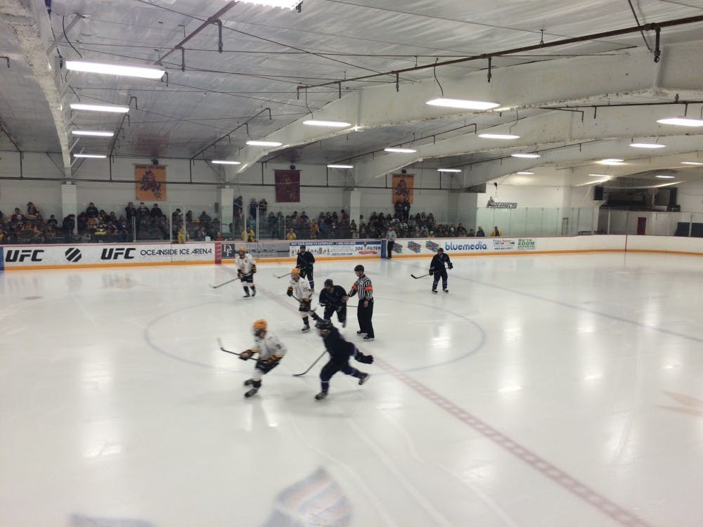 Skaters react to a face-off during ASU's game versus Niagara on Friday, Sept. 19, 2014. (Photo by Fabian Ardaya)
