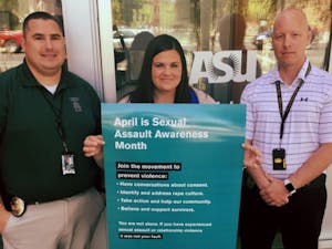 From left,&nbsp;detective Nate Thompson, Lynn Spillers and detective Travis Smith pose for a photo&nbsp;outside the ASU Police Department office in Tempe, Arizona.