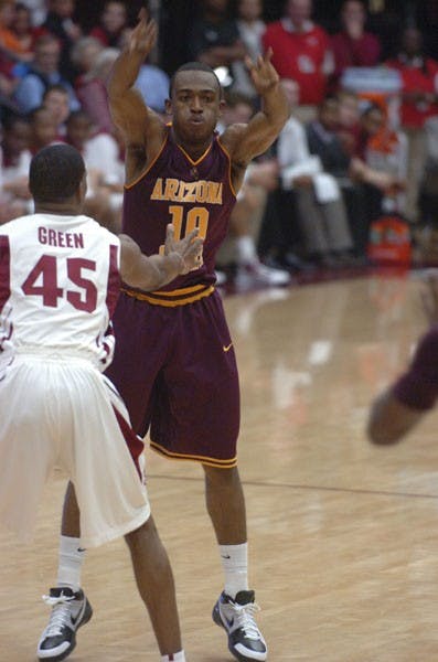 ASU junior guard Jamelle McMillan passes the ball around a defender on Feb. 25 in Palo Alto. ASU beat Stanford 68-60. (Photo Courtesy of Kyle Anderson)