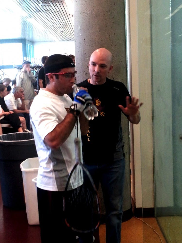 Coach Schenck having a teaching moment. Photo by Brendan Capria.