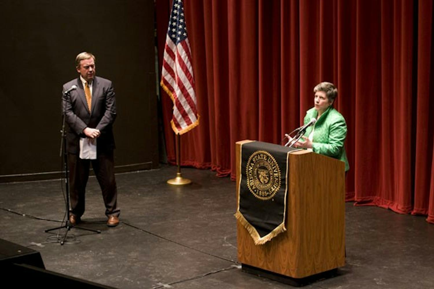 QUESTIONS OF SECURITY: ASU President Michael Crow reads audience questions to Secretary of Homeland Security Janet Napolitano Thursday night. Napolitano gave a lecture at ASU, speaking of her goals with the Homeland Security Department. (Photo by Molly J. Smith)