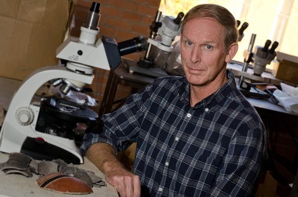 UNEARTHING HISTORY: Associate Professor David Abbott of the school of Human Evolution and Social Change, received the Arizona Archaeological Council Award for his work researching ancient ceramics from the ancient Hohokam civilization that once lived in the Valley area. (Photo by Aaron Lavinsky)