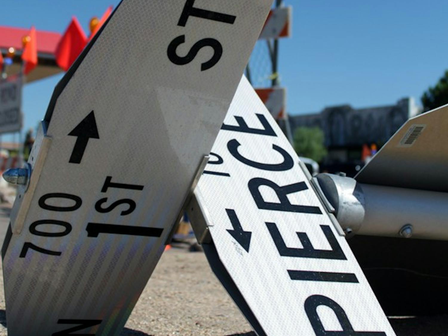 UP IS DOWN: The Pierce and 1st streets road sign lays on the ground because of construction on 1st street. (Photo by Beth Easterbrook)