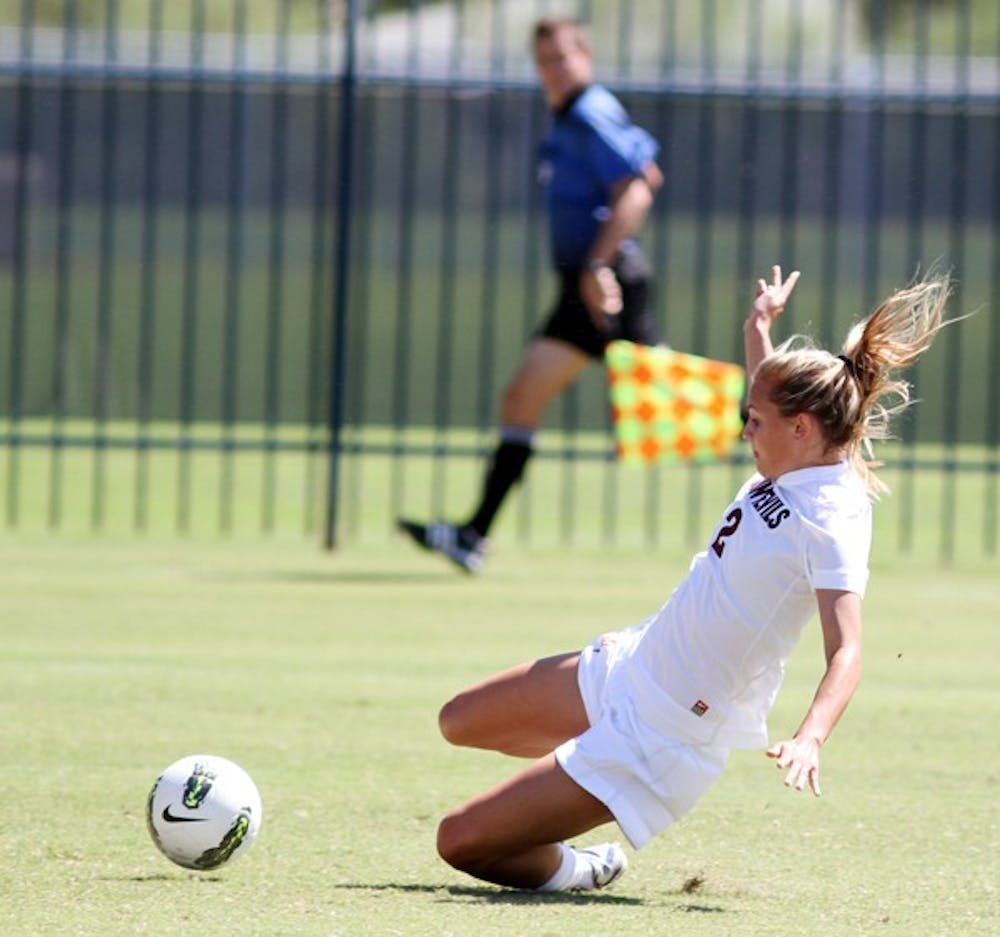 ANOTHER SPLIT: ASU freshman forward Alexandra Doller slides into the ball during the Sun Devils’ 1-0 victory over Pacific on Sunday. ASU split its games for the second weekend in a row. (Photo courtesy of Steve Rodriguez)