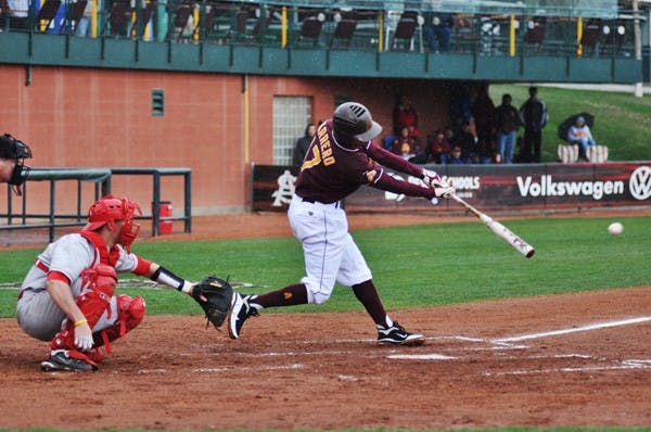 Rain check: ASU sophomore infielder Deven Marrero stretches for the ball during the Sun Devils’ rain-delayed 8-1 victory over New Mexico on Saturday. A four-game set against UNM was cut short because of weather. (Photo by Sierra Smith)