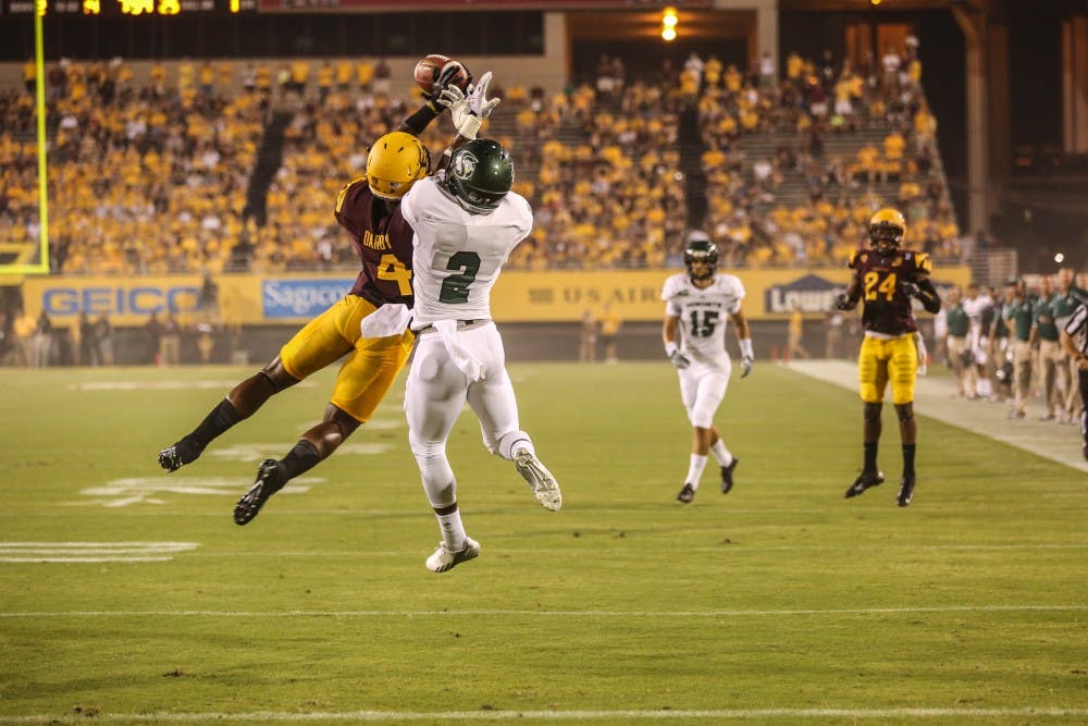Senior Alden Darby jumps to catch the football during the first quarter of the game against Sacramento State in Tempe. Sacramento State lost 55-0. (Photo by Arianna Grainey)