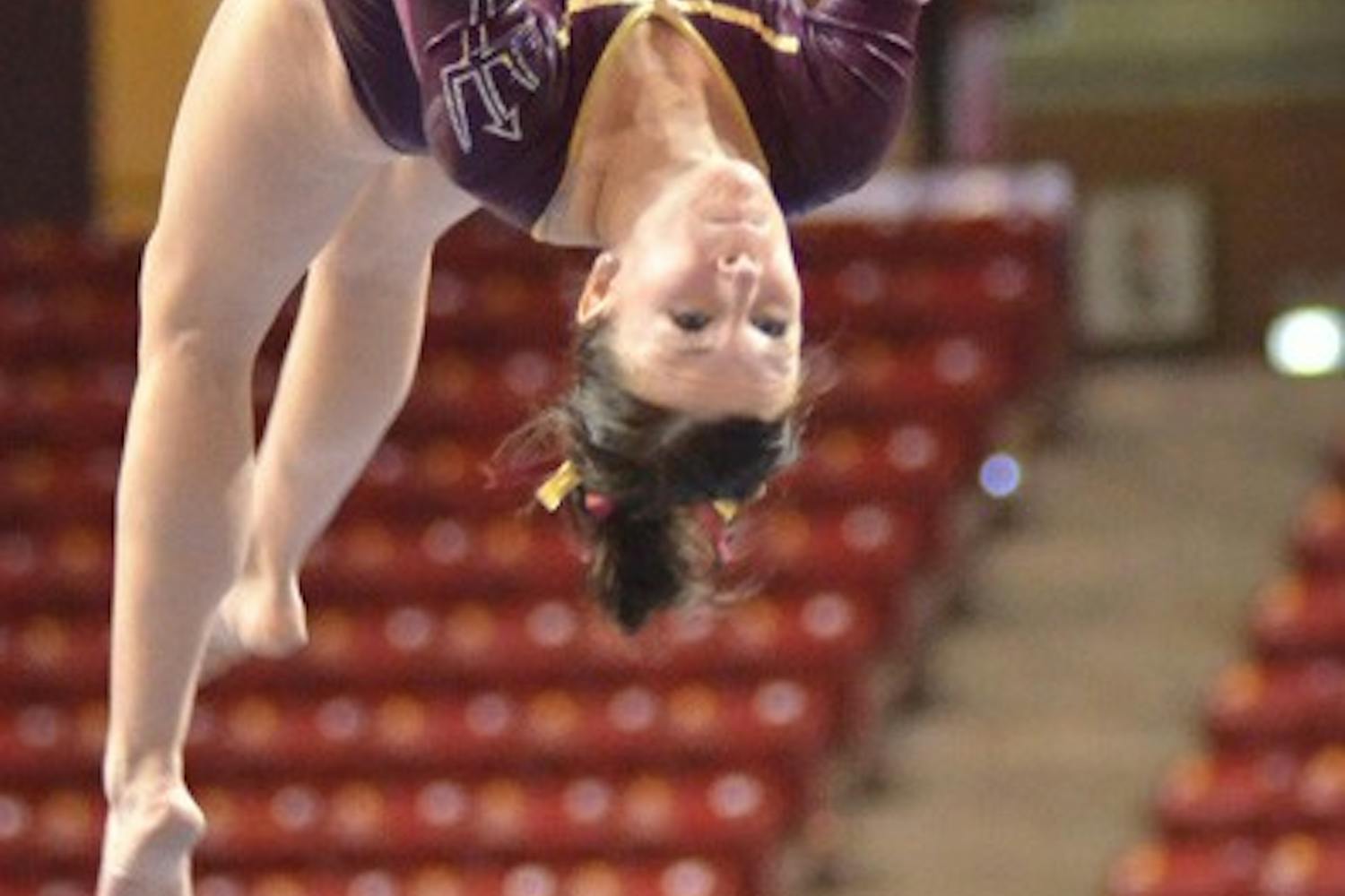 Precision Balance: Even with a career high score of 9.800 on the beam, ASU junior Kelly Reilly and the Sun Devils couldn’t top Oregon State in Tempe on Sunday. ASU recently found out that two of its gymnasts are done competing for the season due to knee injuries. (Photo by Aaron Lavinsky)