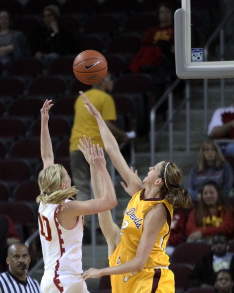 SWATTED AWAY: ASU junior forward Becca Tobin goes for a block on a shot by USC senior guard Heather Oliver during the Sun Devils’ 62-52 loss Saturday afternoon in Los Angeles. (Photo courtesy of Steve Rodriguez)