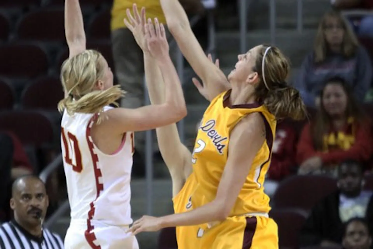 SWATTED AWAY: ASU junior forward Becca Tobin goes for a block on a shot by USC senior guard Heather Oliver during the Sun Devils’ 62-52 loss Saturday afternoon in Los Angeles. (Photo courtesy of Steve Rodriguez)