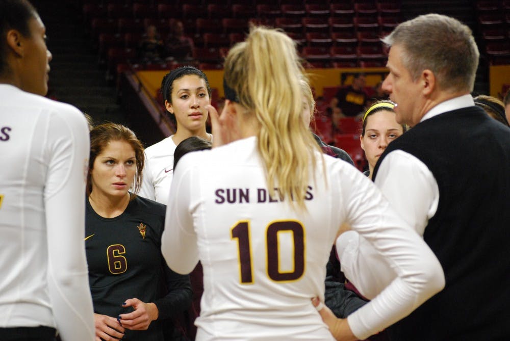 The ASU Sun Devil volleyball team gathers for a timeout in the fourth set of the match against Utah. The Sun Devils lost against Utah in all four sets.(Photo by Murphy Bannerman)