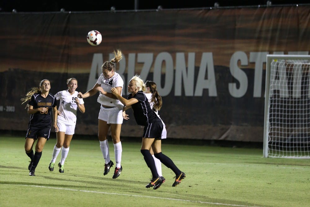 ASU tries to regain control of the ball as Cal State Northridge player Chloe McDaniel jumps to gain possession. (Photo by Arianna Grainey) 