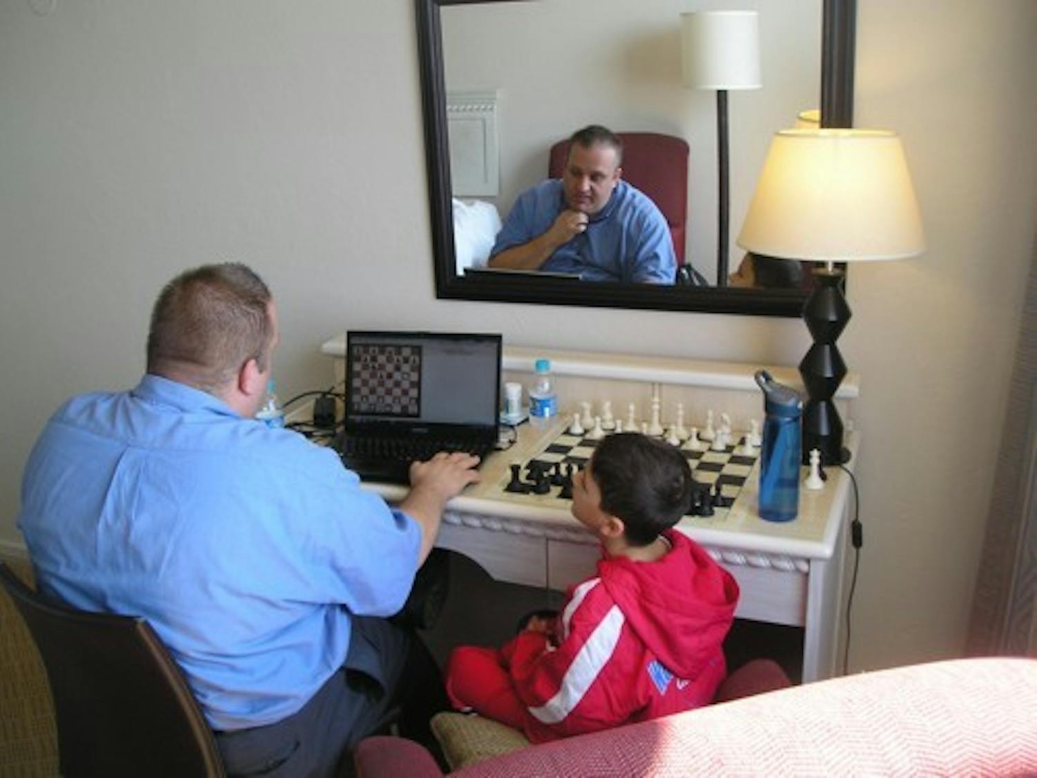Justin Friedlander preps for his chess games with GM Finegold for Round 7. (Photo Courtesy of Robert Friedlander)