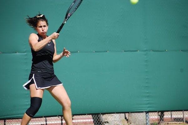 Senior Nicole Smith returns a shot against Pepperdine on Feb. 25. The ASU tennis team was able to defeat the Waves despite losing their first doubles match. (Photo by Murphy Bannerman)