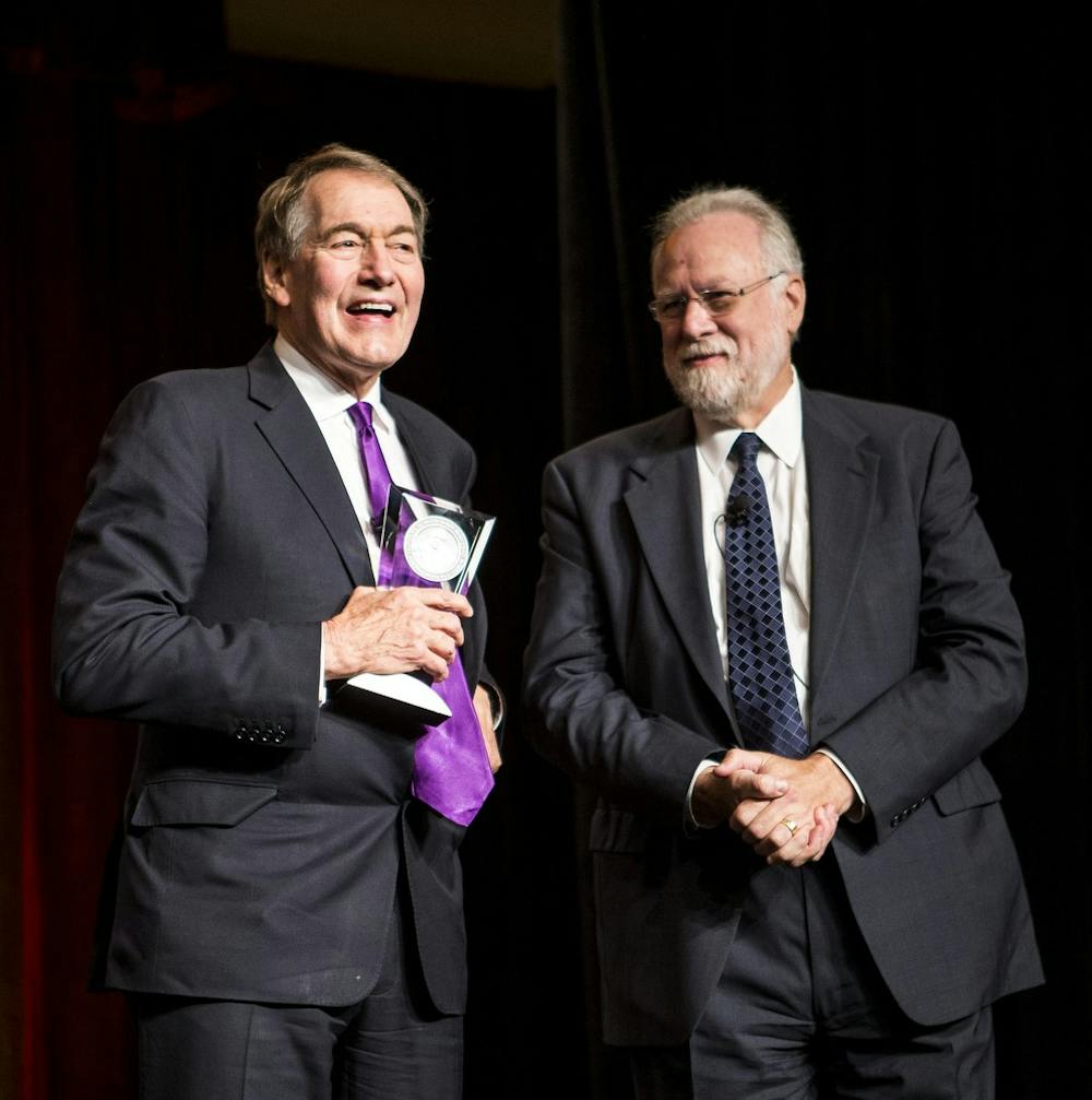 Arizona State University Provost Mark Searle (right) presents CBS morning news anchor Charlie Rose with the Walter Cronkite Award for Excellence in Journalism award during a celebratory luncheon in the Sheraton Hotel in Downtown Phoenix on Monday, Oct. 19, 2015.