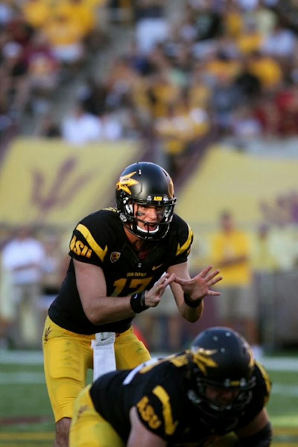 GETTING A GRASP: ASU junior quarterback Brock Osweiler calls for the snap during the Sun Devils’ 48-14 win over Colorado on Saturday. A win over UCLA this Saturday will give ASU the Pac-12 South lead and a ticket to the Pac-12 Championships if they win the rest of their games. (Photo by Lisa Bartoli)