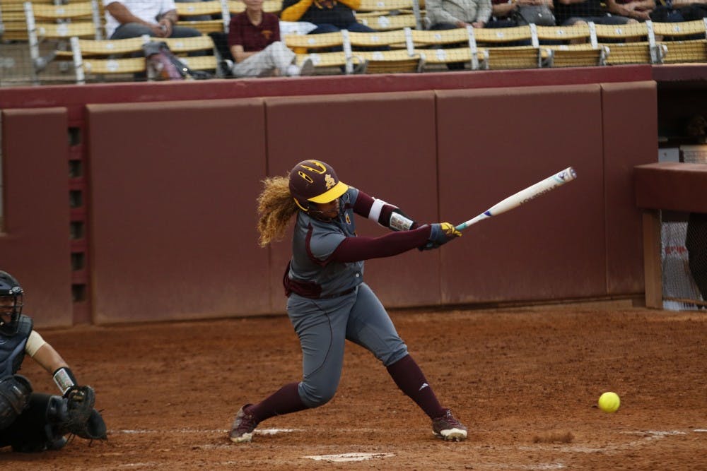 Sophomore outfielder Ulufa (Fa) Leilua (9) hits the ball during a game against Purdue at Alberta B. Farrington Softball Stadium in Tempe, Arizona, on Friday, Feb. 10, 2017. The Sun Devils won the game, 3-0.