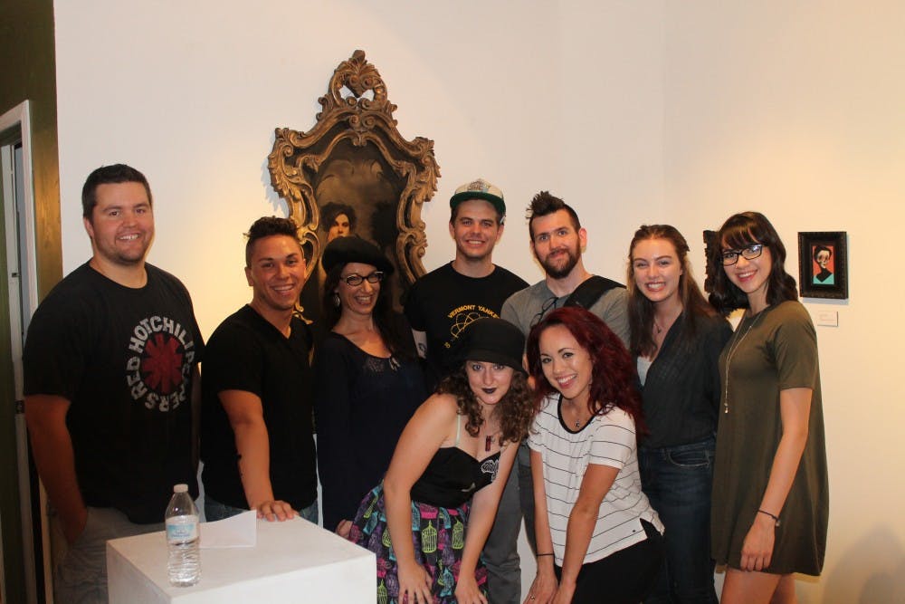 Rosemarie Dombrowski (third from left) and her students pose for a photo at {9} The Gallery on Grand Avenue in Phoenix.