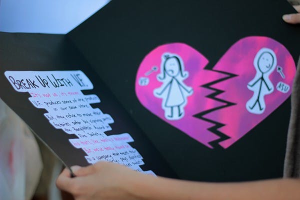 Activists of the United Students Against Sweatshops organization made a Valentine’s Day card to deliver to President Crow on Feb. 14. The organization wants ASU to end its contract with VF Corporation brands sold on campus.  (Photo by Alexis Macklin)