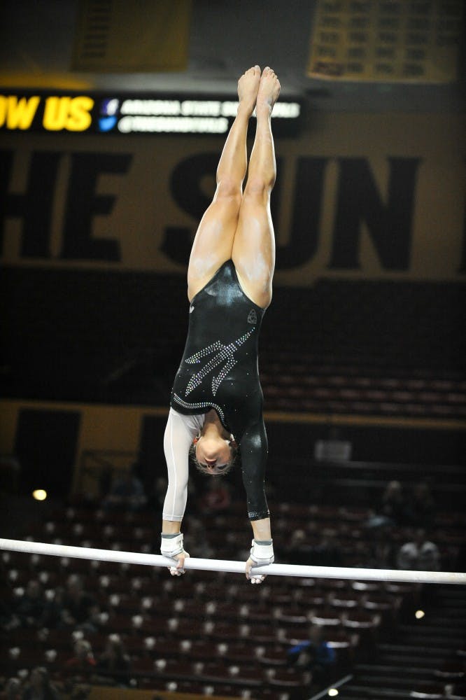 Junior Allie Salas performs her routine on Jan. 9, 2015, at Wells Fargo Arena. (Andrew Ybanez/ The State Press)