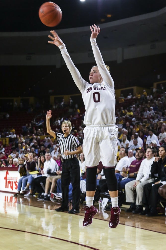 Jaymes Khademi, head chef assembles pizzas inside Saffron JAK, the newest food truck in downtown Phoenix. (photo by Diana Lustig)