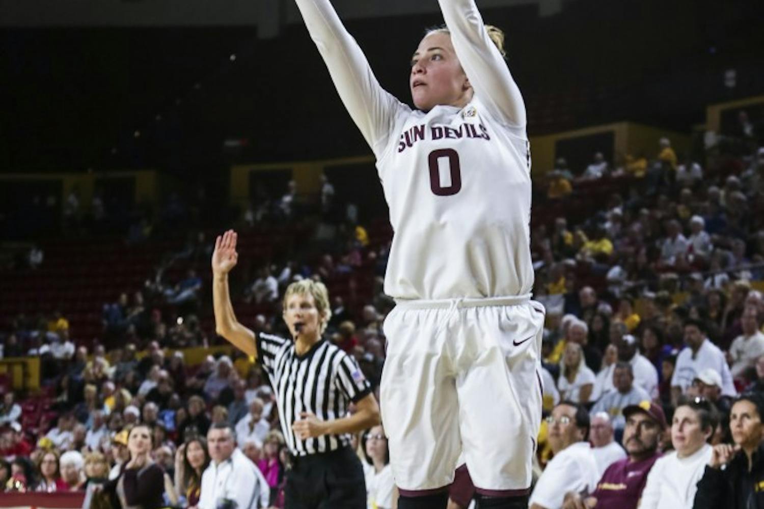 Jaymes Khademi, head chef assembles pizzas inside Saffron JAK, the newest food truck in downtown Phoenix. (photo by Diana Lustig)