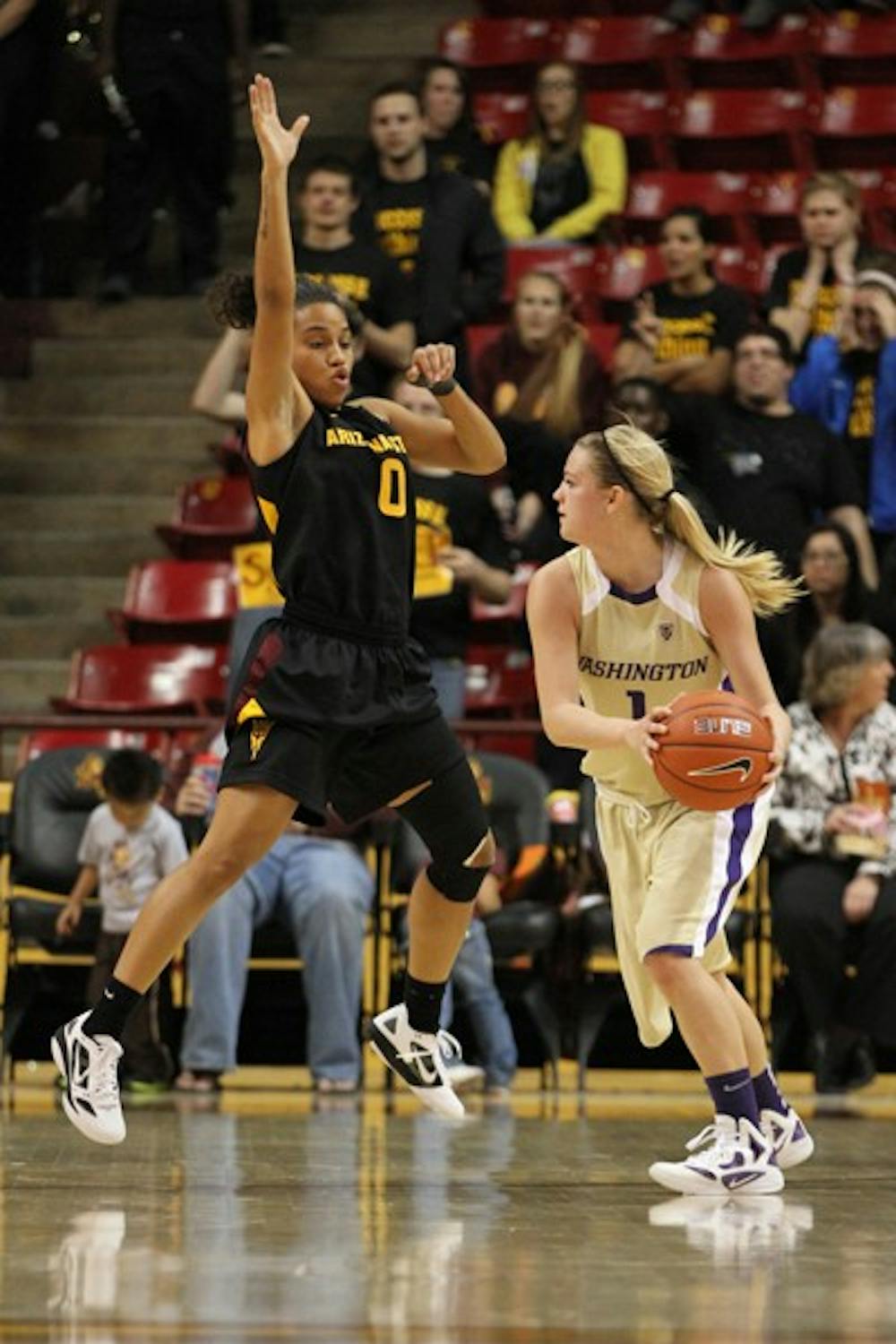 Senior Olivia Major plays animated defense in a game against Washington on Feb. 16. Major led ASU with 14 points as the Sun Devils defeated the Huskies 47–41. (Photo by Sam Rosenbaum)