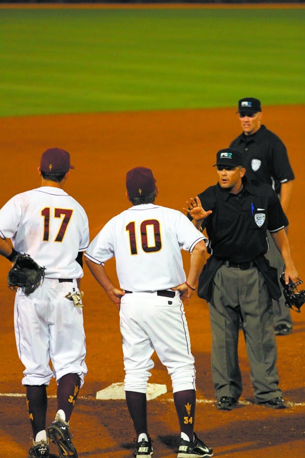 Tim Esmay argues a call in a game against Cal State Fullerton on Wednesday night. Esmay’s Sun Devils gave up 18 hits in their loss to the Titans. (Photo by Sam Rosenbaum)