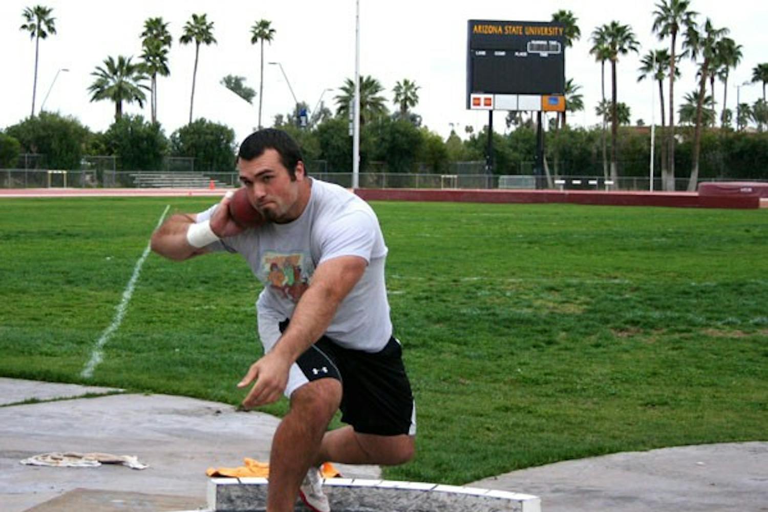 CHAMPIONSHIP-BOUND: Freshman Jordan Clarke practices the shot put during practice at Sun Angel Stadium. ASU will send 11 athletes to the NCAA Indoor Championship meet in Fayetteville, Ark. (Photo by Kyle Thompson)