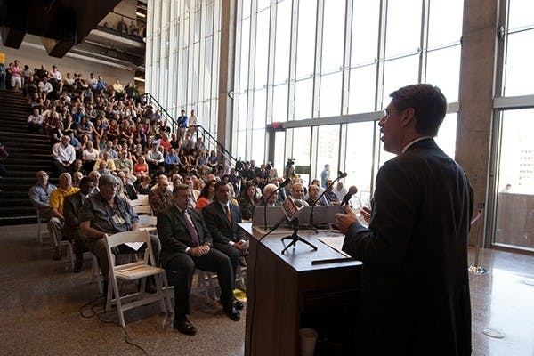 Dr. Morgan R. Olson talks about the many uses and high functionality of the newly constructed College Avenue Commons. The five story, multi-use facility offers classes, offices and labs to Del E. Webb School of Construction and the School of Sustainable Engineering. (Photo by Mario Mendez)
