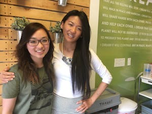 Rachael Kha (left) and Linh La (right) pose for a photo in the Loving Hut Tempe location on Friday, April 7, 2017.&nbsp;La and her family own and manage two Loving Hut locations, and Kha works as head server and cashier at the Tempe location.