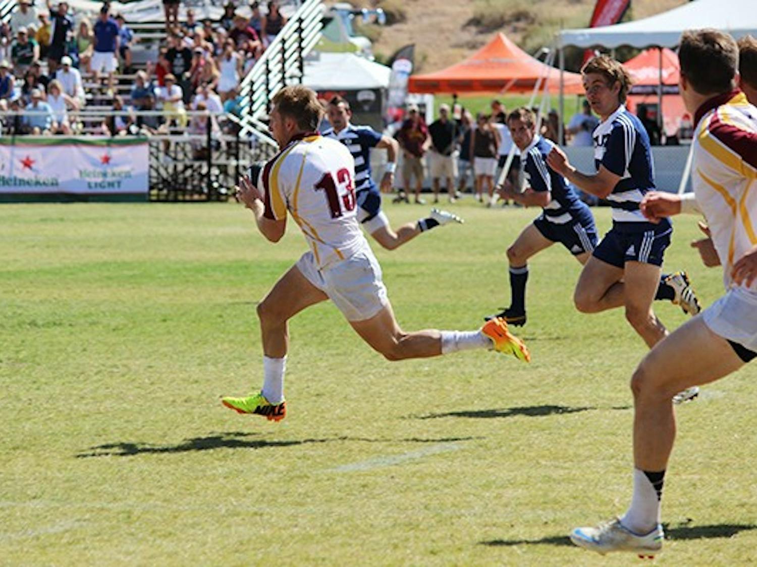 Senior center Adam Sandstrom runs toward the end zone at the Rugby Bowl against BYU on April 12. ASU lost to BYU 52-26.