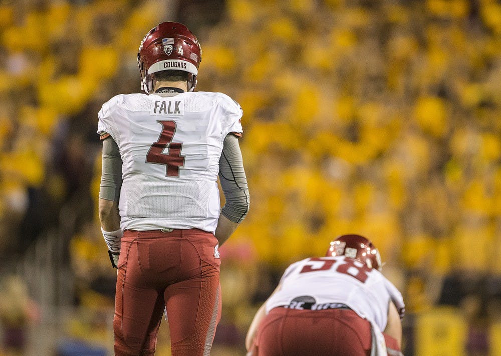 WSU Cougars quarterback Luke Falk (4) prepares to start a play during a game against ASU in Sun Devil Stadium, in Tempe, Arizona, on Saturday, Oct. 22, 2016.