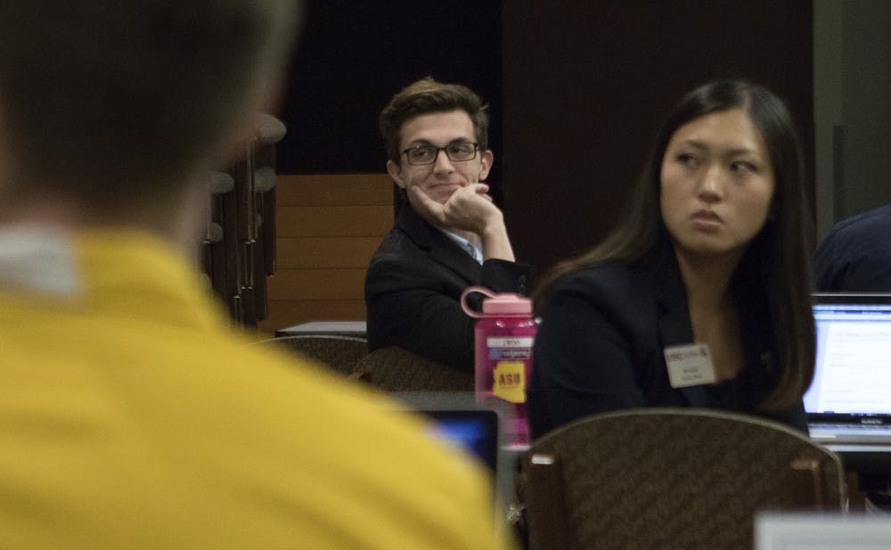 Government Operations committee senator Kanin Pruter, center, looks over during organization reports at the USG meeting Tuesday, Oct. 20, 2015, at the Memorial Union in Tempe. 