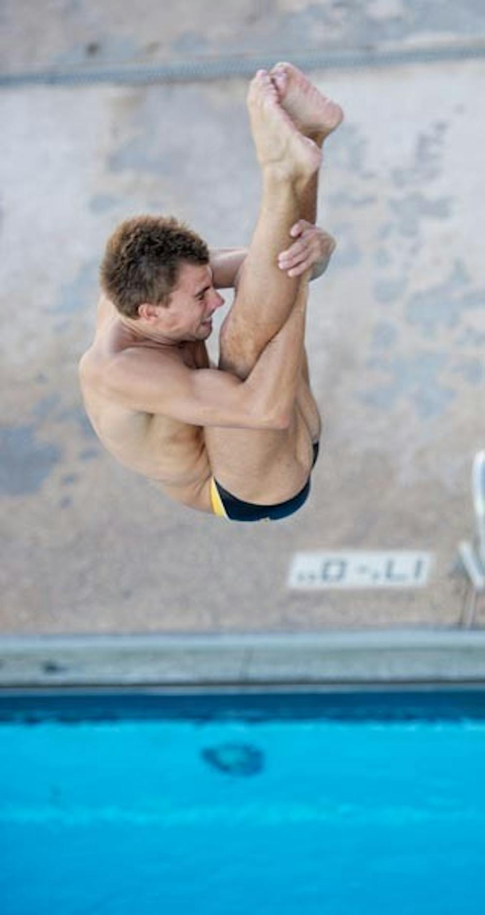 WELL TUCKED: ASU junior Constantin Blaha works on his form during practice last week. Blaha won the 3-meter final at the Wildcat Invitational in Tucson on Saturday with a score of 405.85. (Photo by Michael Arellano)