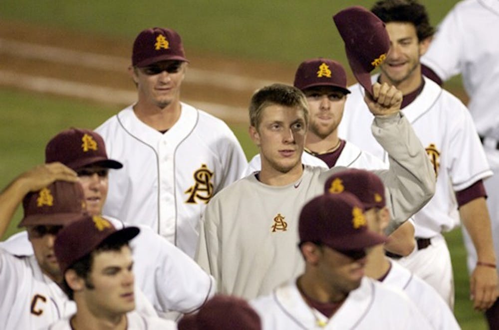 ASU pitcher Merrill Kelly lifts his hat to the crowd as he and his teammates make their way off the field after defeating the Milwaukee Panthers Friday night. Kelly now has record of 9-2 with and ERA of 3.75. (Photo by Scott Stuk)