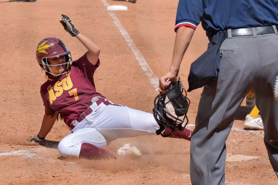 Senior outfielder Sierra Rodriguez slides safely into home plate for another Sun Devil run on Sunday, March 22, 2015, at Farrington Stadium as the ASU Sun Devils faced off with the California Bears. (J. Bauer-Leffler/ The State Press)