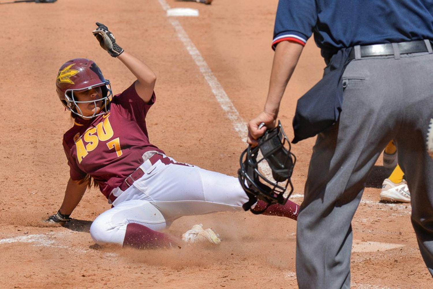 Senior outfielder Sierra Rodriguez slides safely into home plate for another Sun Devil run on Sunday, March 22, 2015, at Farrington Stadium as the ASU Sun Devils faced off with the California Bears. (J. Bauer-Leffler/ The State Press)