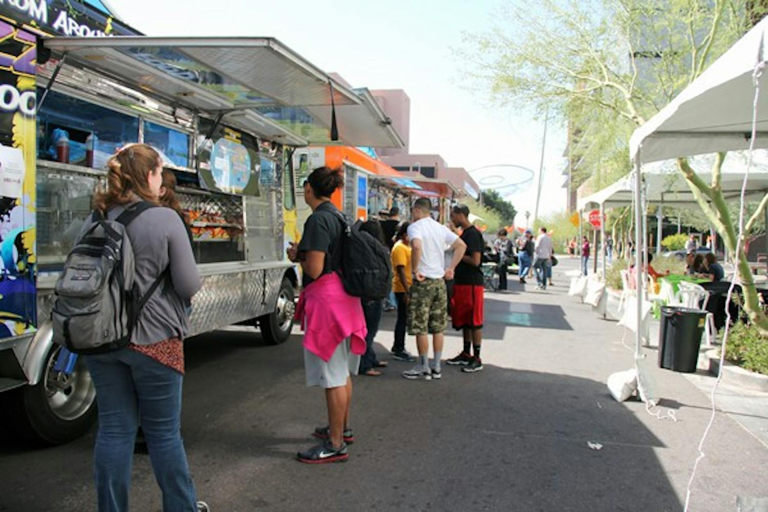 ASU students buy Mexican, barbecue and other types of food from food trucks on Taylor Street Monday afternoon. (Photo by Diana Lustig)