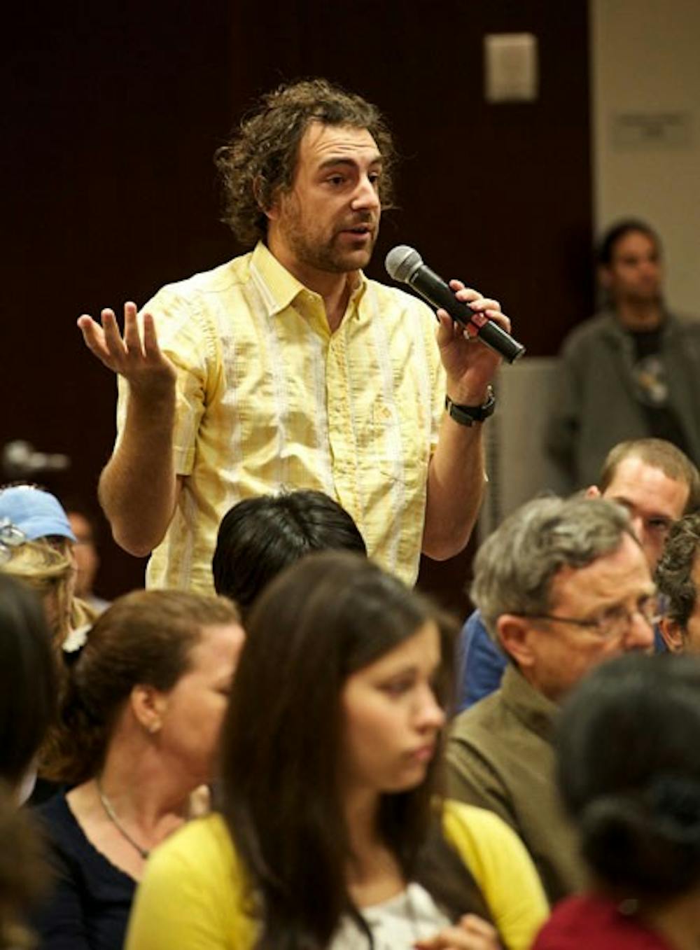 FUTURE OF GRAD STUDENTS: Fereico Waitoller, a graduate student at ASU, questions the panel of deans during a forum to discuss the disbanding of several of ASU's residential college programs. The audience was filled with many graduate students concerned with the future of their current studies. (Photo by Michael Arellano)