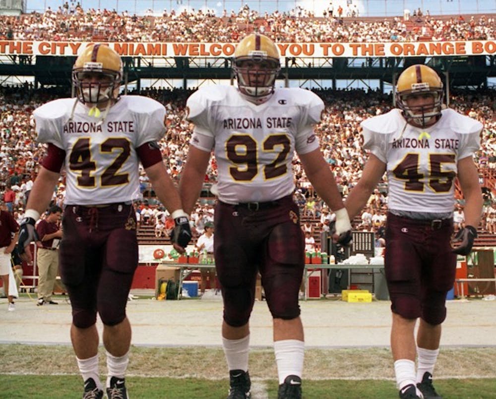 Pat Tillman (left) walks out for a pre-game coin toss. Tillman will be honored Saturday during the eighth annual Pat’s Run. (Photo courtesy of Sun Devil Athletics Media Relations)