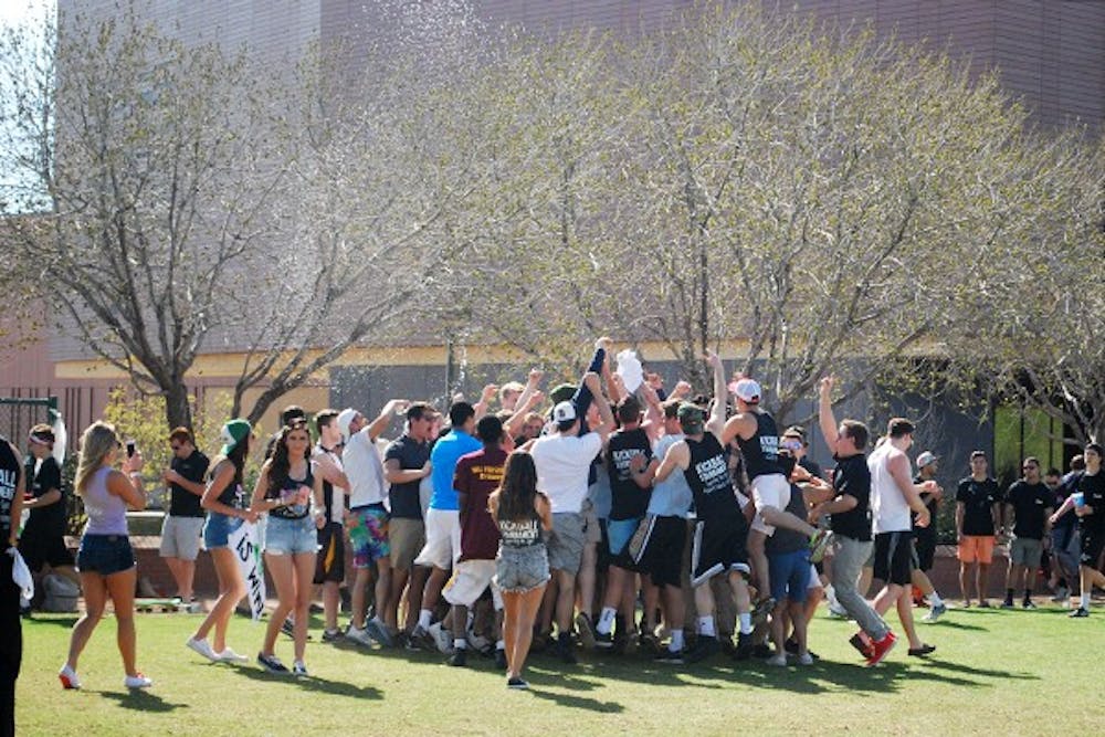 Members of Delta Sigma Phi celebrate with their supporters after a big win. (Photo by Amanda Jensen)