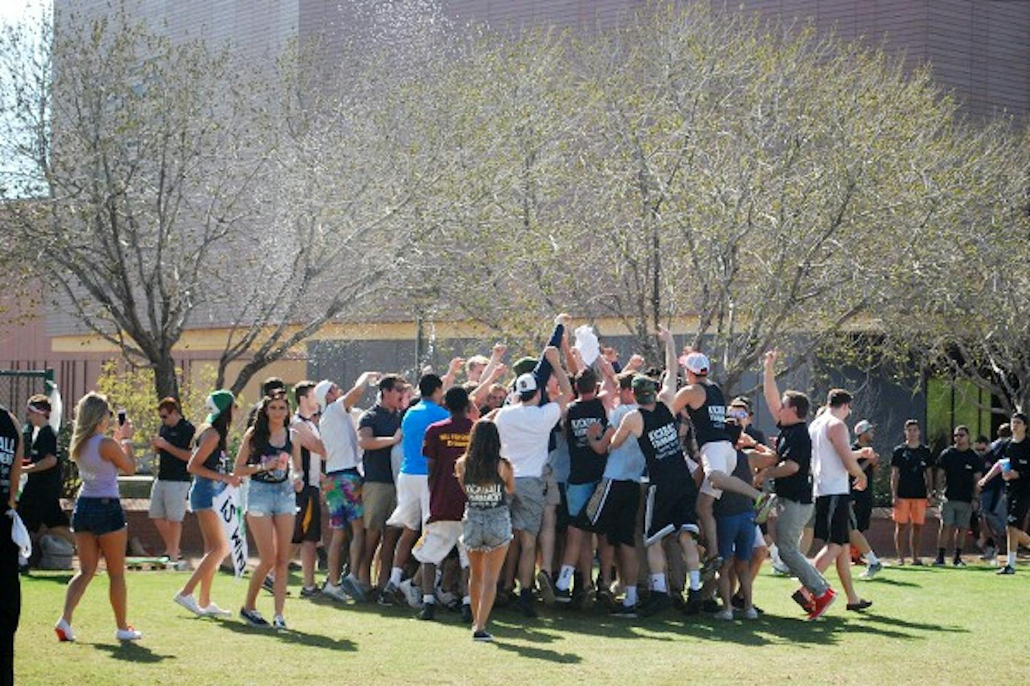 Members of Delta Sigma Phi celebrate with their supporters after a big win. (Photo by Amanda Jensen)