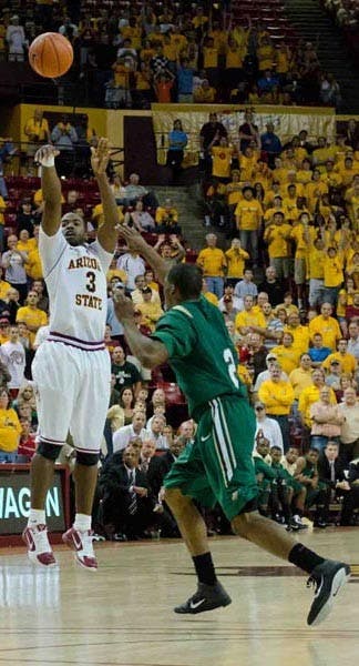 CLUTCH: ASU senior guard Ty Abbot, who hobbled from a knee injury earlier in the game, goes up for the game winning 3-point shot with 2.2 seconds remaining in the Sun Devils' 69-66 victory over the UAB Blazers on Saturday. (Photo by Aaron Lavinsky)
