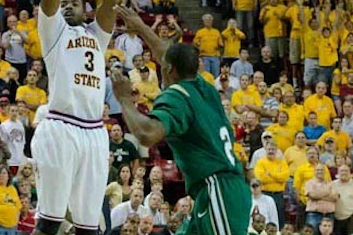 CLUTCH: ASU senior guard Ty Abbot, who hobbled from a knee injury earlier in the game, goes up for the game winning 3-point shot with 2.2 seconds remaining in the Sun Devils' 69-66 victory over the UAB Blazers on Saturday. (Photo by Aaron Lavinsky)