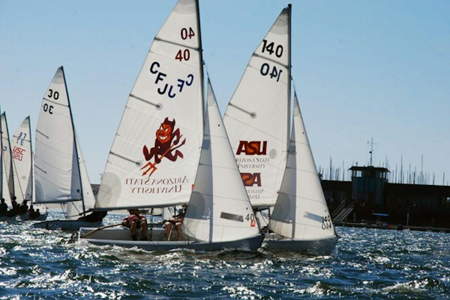 SAILING SAN DIEGO: Junior Mike Garrigan and freshman Chad Hardgrove of the ASU Sailing Club Club sail upwind to the windward mark during the Frosh/Soph Regatta in Mission Bay, San Diego on Oct. 9. The Arizona State University Sailing Club varsity boat placed fourth in the Frosh/Soph Regatta. (Photo courtesy of Gerald Byrnes)