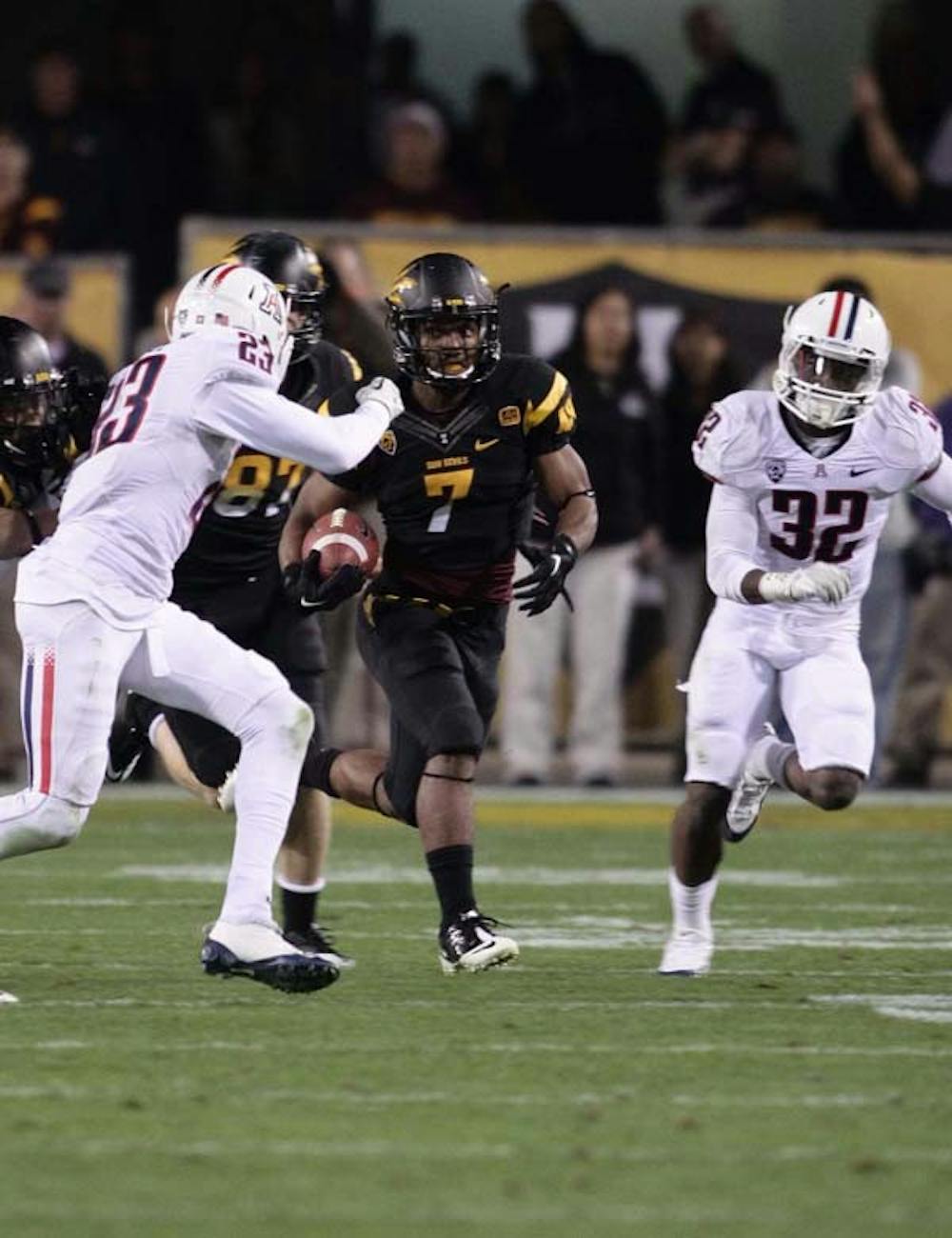 Junior wide receiver Kyle Middlebrooks (7) tries to run past a UA defender during the Sun Devils’ home game against the Wildcats on Sept. 5, 2012. Now a redshirt senior, Middlebrooks looks to mentor a reinvigorated special teams unit and be more productive on punt and kickoff returns. (Photo by Beth Easterbrook)

