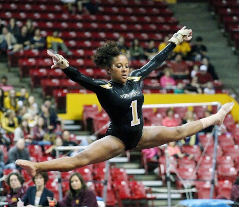 Beaté Jones does the splits during her floor routine in a meet against UA on Jan. 27. Jones will guide the young Sun Devils gymnastics squad during the team’s first road trip this weekend. (Photo by Beth Easterbrook)