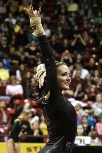 Brianna Gades flashes the pitchfork at the end of her floor routine at Friday's meet against Washington. (Photo courtesy of Arianna Grainey)