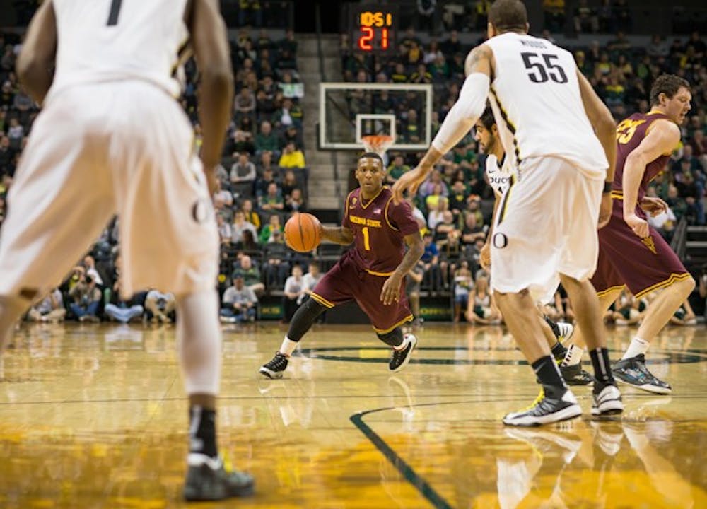 Freshman guard Jahii Carson looks to pass through traffic during the second half of Oregon's 68-65 victory over the ASU Sun Devils at Matt Knight Arena on January 13th, 2013. (Courtesy of Michael Arellano)